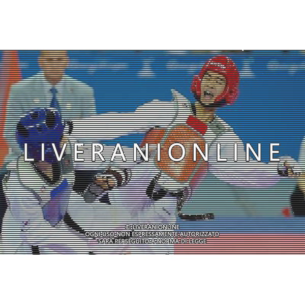 (101120) -- GUANGZHOU, Nov. 20, 2010 () -- Chutchawal Khawlaor(R) of Thailand fights against Kim Seong Ho of South Korea during the final of men\'s under 54kg of taekwondo at the 16th Asian Games in Guangzhou, south China\'s Guangdong Province, Nov. 20, 2010. Chutchawal Khawlaor claimed the title with 8-6. (/Chen Kai)(wll) ©photoshot/Agenzia Aldo Liverani Sas - ITALY ONLY - CINA: 16mi Giochi Asiatici
