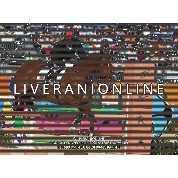 (101120) -- GUANGZHOU, Nov. 20, 2010 () -- China\'s Yang Hua competes with his horse Caro Ciaro during the Eventing Team Qualifier Jumping of Equestrian competition at the 16th Asian Games in Guangzhou, south China\'s Guangdong Province, Nov. 20, 2010. China won the bronze medal of Eventing Team with 164.90 points in total result. (/Xiang Mei) ©photoshot/Agenzia Aldo Liverani Sas - ITALY ONLY - CINA: 16mi Giochi Asiatici