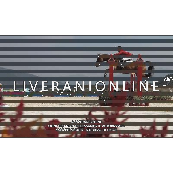 (101120) -- GUANGZHOU, Nov. 20, 2010 () -- Thailand\'s Nina Ligon competes with her horse Chai Thai during the Eventing Team Qualifier Jumping of Equestrian competition at the 16th Asian Games in Guangzhou, south China\'s Guangdong Province, Nov. 20, 2010. Thailand won the silver medal of Eventing Team with 159.60 points in total result. (/Xiang Mei) ©photoshot/Agenzia Aldo Liverani Sas - ITALY ONLY - CINA: 16mi Giochi Asiatici