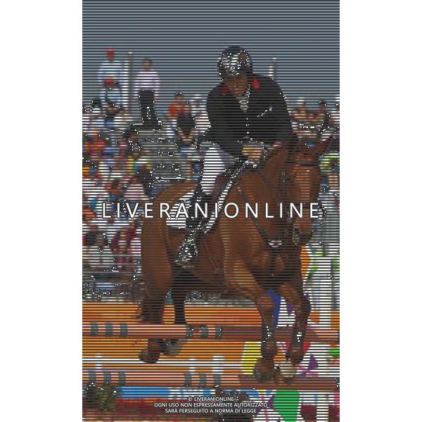 (101120) -- GUANGZHOU, Nov. 20, 2010 () -- Japan\'s Oiwa Yoshiaki competes with his horse Noonday De Conde during the Eventing Team Qualifier Jumping of Equestrian competition at the 16th Asian Games in Guangzhou, south China\'s Guangdong Province, Nov. 20, 2010. Japan claimed the title of Eventing Team with 133.40 points in total result. (/Xiang Mei) ©photoshot/Agenzia Aldo Liverani Sas - ITALY ONLY - CINA: 16mi Giochi Asiatici