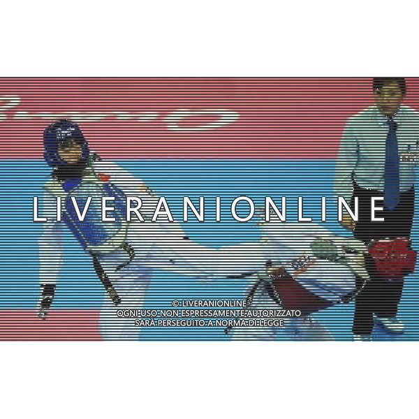 (101120) -- GUANGZHOU, Nov. 20, 2010 () -- Luo Wei(L) of China fights against Feruza Yergeshova of Kazakhstan during the final of women\'s under 73kg of taekwondo at the 16th Asian Games in Guangzhou, south China\'s Guangdong Province, Nov. 20, 2010. Luo wei claimed the title with 5-4. (/Guo Dayue)(wll) ©photoshot/Agenzia Aldo Liverani Sas - ITALY ONLY - CINA: 16mi Giochi Asiatici