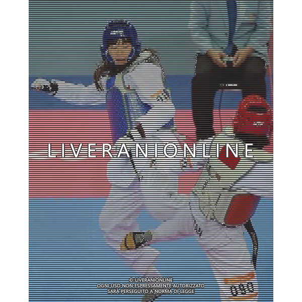 (101120) -- GUANGZHOU, Nov. 20, 2010 () -- Luo Wei(L) of China fights against Feruza Yergeshova of Kazakhstan during the final of women\'s under 73kg of taekwondo at the 16th Asian Games in Guangzhou, south China\'s Guangdong Province, Nov. 20, 2010. Luo wei claimed the title with 5-4. (/Guo Dayue)(wll) ©photoshot/Agenzia Aldo Liverani Sas - ITALY ONLY - CINA: 16mi Giochi Asiatici