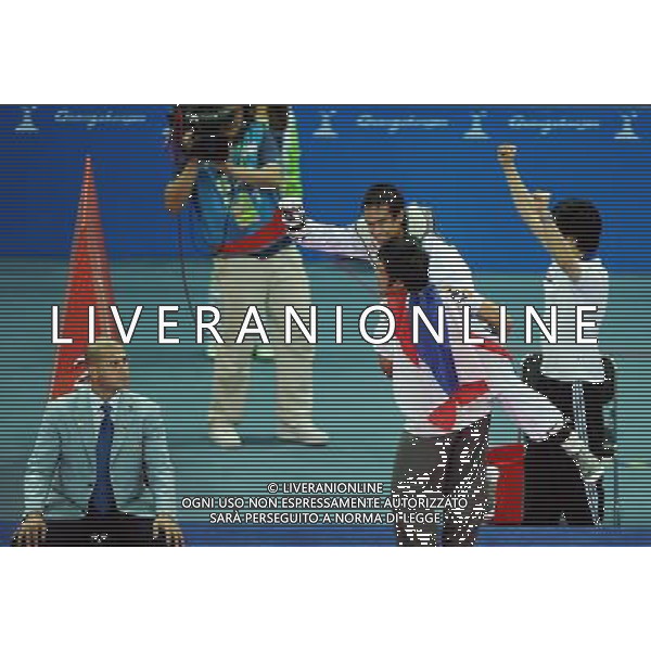 (101120) -- GUANGZHOU, Nov. 20, 2010 () -- Chutchawal Khawlaorn (2nd R) of Thailand celebrates with his coach after the final of men\'s under 54kg of taekwondo against Kim Seong Ho of South Korea at the 16th Asian Games in Guangzhou, south China\'s Guangdong Province, Nov. 20, 2010. Chutchawal Khawlaor claimed the title with 8-6. (/Guo Dayue)(wll) ©photoshot/Agenzia Aldo Liverani Sas - ITALY ONLY - CINA: 16mi Giochi Asiatici