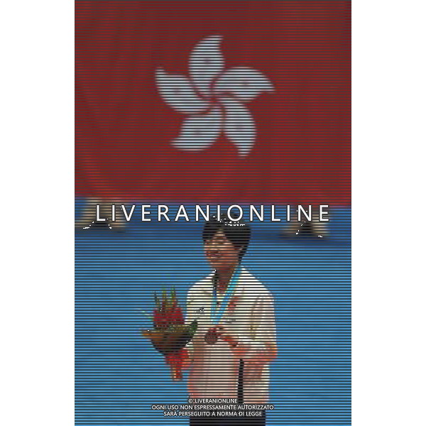 (101120) -- GUANGZHOU, Nov. 20, 2010 () -- Bronze medalist Yip Pui Yin of Hong Kong of China poses on the podium during the awarding ceremony for the women\'s singles of badminton at the 16th Asian Games in Guangzhou, south China\'s Guangdong Province, Nov. 20, 2010. (/Lu Hanxin) ©photoshot/Agenzia Aldo Liverani Sas - ITALY ONLY - CINA: 16mi Giochi Asiatici