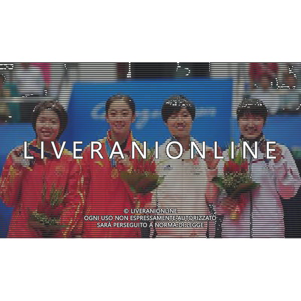 (101120) -- GUANGZHOU, Nov. 20, 2010 () -- Gold medalist Wang Shixian (2nd L) of China, silver medalist Wang Xin (1st L) of China, bronze medalist Yip Pui Yin (2nd R) of Hong Kong of China and Eriko Hirose of Japan pose on the podium during the awarding ceremony for the women\'s singles of badminton at the 16th Asian Games in Guangzhou, south China\'s Guangdong Province, Nov. 20, 2010. (/Lu Hanxin) ©photoshot/Agenzia Aldo Liverani Sas - ITALY ONLY - CINA: 16mi Giochi Asiatici
