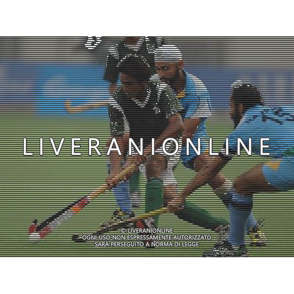 (101120) -- GUANGZHOU, Nov. 20, 2010 () -- Shafqat Rasool (L) of Pakistan competes during the men\'s preliminary of hockey competition against India at the 16th Asian Games in Guangzhou, south China\'s Guangdong Province, Nov. 20, 2010. India won 3-2. (/Yang Lei) ©photoshot/Agenzia Aldo Liverani Sas - ITALY ONLY - CINA: 16mi Giochi Asiatici