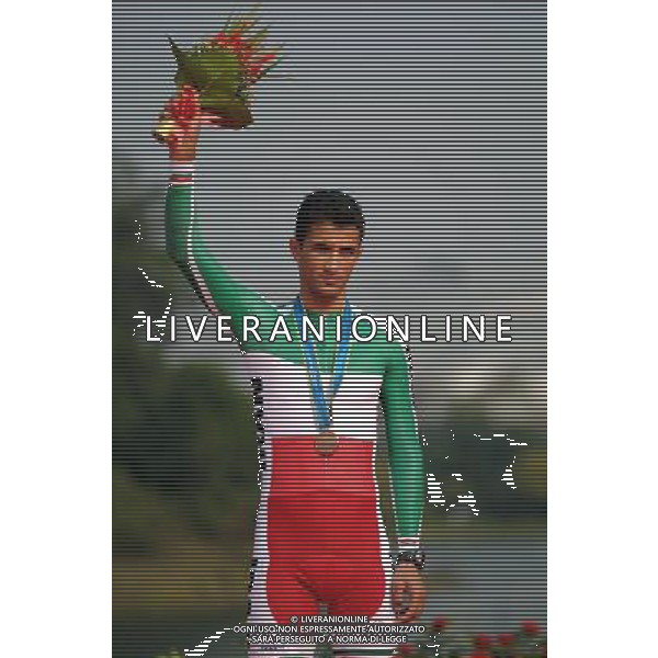 (101120) -- GUANGZHOU, Nov. 20, 2010 () -- Hossein Askari of Iran poses during the awarding ceremony of the men\'s individual time trial of Cycling Road at the 16th Asian Games in Guangzhou, south China\'s Guangdong Province, Nov. 20, 2010. Hossein Askari won the bronze with 1 hour 8 minutes and 48.49 seconds. (/Li Ga) ©photoshot/Agenzia Aldo Liverani Sas - ITALY ONLY - CINA: 16mi Giochi Asiatici