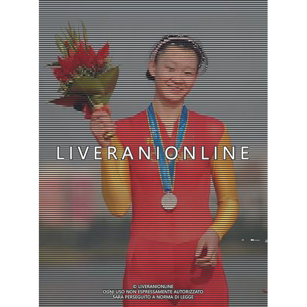 (101120) -- GUANGZHOU, Nov. 20, 2010 () -- Jiang Fan of China poses during the awarding ceremony of the women\'s individual time trial of cycling road at the 16th Asian Games in Guangzhou, south China\'s Guangdong Province, Nov. 20, 2010. Jiang Fan won the silver with 50 minutes 4.62 seconds. (/Li Ga) ©photoshot/Agenzia Aldo Liverani Sas - ITALY ONLY - CINA: 16mi Giochi Asiatici