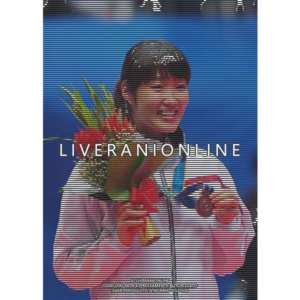 (101120) -- GUANGZHOU, Nov. 20, 2010 () -- Bronze medalists Eriko Hirose of Japan poses during the awarding ceremony for the women\'s singles of badminton at the 16th Asian Games in Guangzhou, south China\'s Guangdong Province, Nov. 20, 2010. (/Lu Hanxin) ©photoshot/Agenzia Aldo Liverani Sas - ITALY ONLY - CINA: 16mi Giochi Asiatici