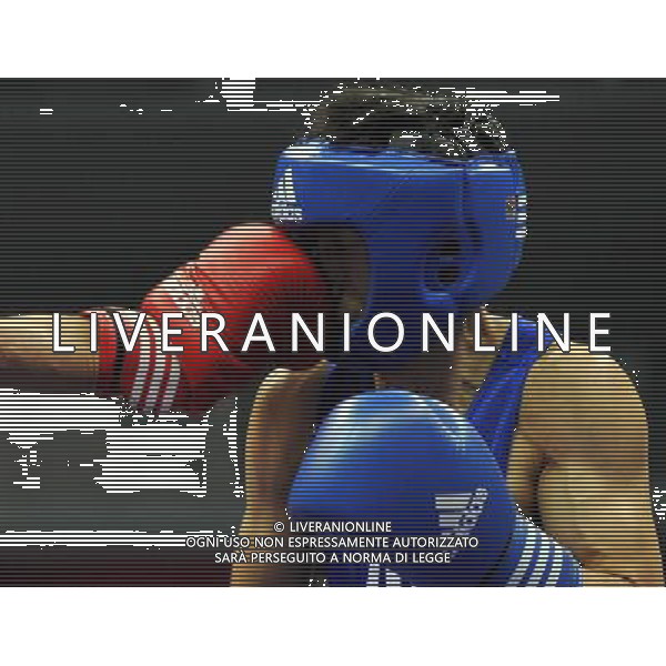 (101120) -- FOSHAN, Nov. 20, 2010 () -- Zou Shiming of China is hit by Jasurbek Latipov of Uzbekistan during the men\'s 46-49 kg match of boxing competition at the 16th Asian Games in Guangzhou, south China\'s Guangdong Province, Nov. 20, 2010. Zou Shiming won 9-2. (/Gong Lei) ©photoshot/Agenzia Aldo Liverani Sas - ITALY ONLY - CINA: 16mi Giochi Asiatici