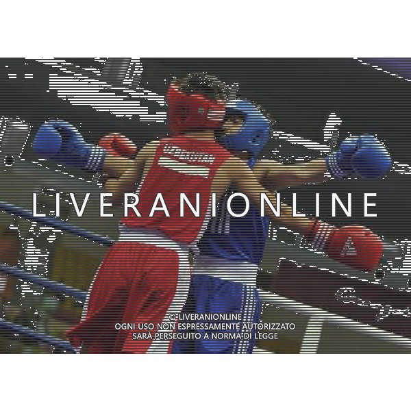 (101120) -- FOSHAN, Nov. 20, 2010 () -- Zou Shiming (back) of China and Jasurbek Latipov of Uzbekistan greets each other during the men\'s 46-49 kg match of boxing competition at the 16th Asian Games in Guangzhou, south China\'s Guangdong Province, Nov. 20, 2010. Zou Shiming won 9-2. (/Gong Lei) ©photoshot/Agenzia Aldo Liverani Sas - ITALY ONLY - CINA: 16mi Giochi Asiatici