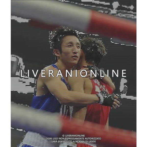 (101120) -- FOSHAN, Nov. 20, 2010 () -- Zou Shiming (L) of China hugs with Jasurbek Latipov of Uzbekistan after the men\'s 46-49 kg match of boxing competition at the 16th Asian Games in Guangzhou, south China\'s Guangdong Province, Nov. 20, 2010. Zou Shiming won 9-2. (/Gong Lei) ©photoshot/Agenzia Aldo Liverani Sas - ITALY ONLY - CINA: 16mi Giochi Asiatici