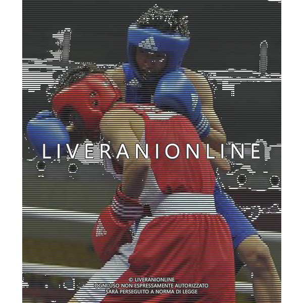 (101120) -- FOSHAN, Nov. 20, 2010 () -- Zou Shiming (back) of China competes during the men\'s 46-49 kg match of boxing competition against Jasurbek Latipov of Uzbekistan at the 16th Asian Games in Guangzhou, south China\'s Guangdong Province, Nov. 20, 2010. Zou Shiming won 9-2. (/Gong Lei) ©photoshot/Agenzia Aldo Liverani Sas - ITALY ONLY - CINA: 16mi Giochi Asiatici