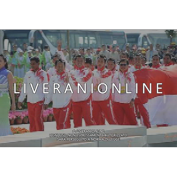 (101120) -- GUANGZHOU, Nov. 20, 2010 () -- Gold medalists Indonesian rowers walk to the podium during the awarding ceremony for the men\'s 250m straight race grand competition of dragon boat at the 16th Asian Games in Guangzhou, south China\'s Guangdong Province, Nov. 20, 2010. (/Guo Yong) ©photoshot/Agenzia Aldo Liverani Sas - ITALY ONLY - CINA: 16mi Giochi Asiatici