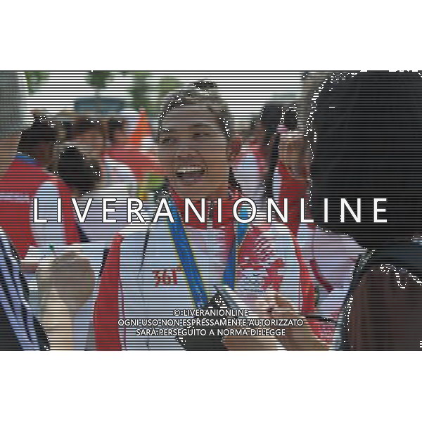 (101120) -- GUANGZHOU, Nov. 20, 2010 () -- Indonesian captain Farida Farida is interviewed after the awarding ceremony of the women\'s 250m straight race grand competition of dragon boat at the 16th Asian Games in Guangzhou, south China\'s Guangdong Province, Nov. 20, 2010. Indonesia won the silver medals of the event. (/Guo Yong) ©photoshot/Agenzia Aldo Liverani Sas - ITALY ONLY - CINA: 16mi Giochi Asiatici