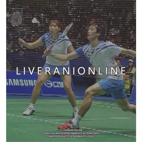 (101120) -- GUANGZHOU, Nov. 20, 2010 () -- Shin Baekcheol (R) and Lee Hyojung of South Korea compete in the mixed doubles semifinal of badminton competition against He Hanbin and Ma Jin of China at the 16th Asian Games in Guangzhou, south China\'s Guangdong Province, Nov. 20, 2010. Shin Baekcheol and Lee Hyojung won 2-1 to enter the final. (/Lu Hanxin) ©photoshot/Agenzia Aldo Liverani Sas - ITALY ONLY - CINA: 16mi Giochi Asiatici