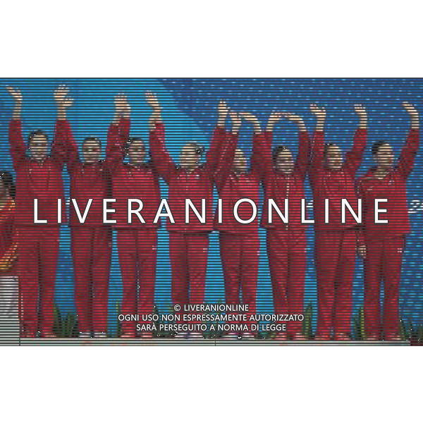 (101120) -- FOSHAN, Nov. 20, 2010 () -- Team DPRK pose on the podium during the awarding ceremony for the women\'s synchronised swimming team free routine at the 16th Asian Games in Foshan, south China\'s Guangdong Province, Nov. 20, 2010. DPRK took the bronze with 173.000 points. (/Fei Maohua) ©photoshot/Agenzia Aldo Liverani Sas - ITALY ONLY - CINA: 16mi Giochi Asiatici