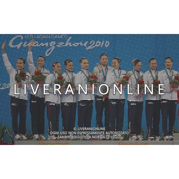 (101120) -- FOSHAN, Nov. 20, 2010 () -- Team Japan pose on the podium during the awarding ceremony for the women\'s synchronised swimming team free routine at the 16th Asian Games in Foshan, south China\'s Guangdong Province, Nov. 20, 2010. Japan took the silver with 186.125 points. (/Fei Maohua) ©photoshot/Agenzia Aldo Liverani Sas - ITALY ONLY - CINA: 16mi Giochi Asiatici