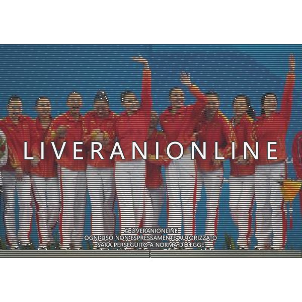 (101120) -- FOSHAN, Nov. 20, 2010 () -- Team China wave to the crowd on the podium during the awarding ceremony for the women\'s synchronised swimming team free routine at the 16th Asian Games in Foshan, south China\'s Guangdong Province, Nov. 20, 2010. China claimed the title with 192.000 points. (/Fei Maohua) ©photoshot/Agenzia Aldo Liverani Sas - ITALY ONLY - CINA: 16mi Giochi Asiatici