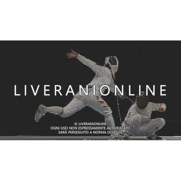 (101120) -- GUANGZHOU, Nov. 20, 2010 () -- China\'s Luo Xiaojuan (L) competes with Japan\'s Nozomi Nakano during their women\'s individual epee final of fencing at the 16th Asian Games in Guangzhou, south China\'s Guangdong Province, Nov. 20, 2010. Luo Xiaojuan won the match 13-10 to claim the title of the event. (/Chen Xiaowei) ©photoshot/Agenzia Aldo Liverani Sas - ITALY ONLY - CINA: 16mi Giochi Asiatici