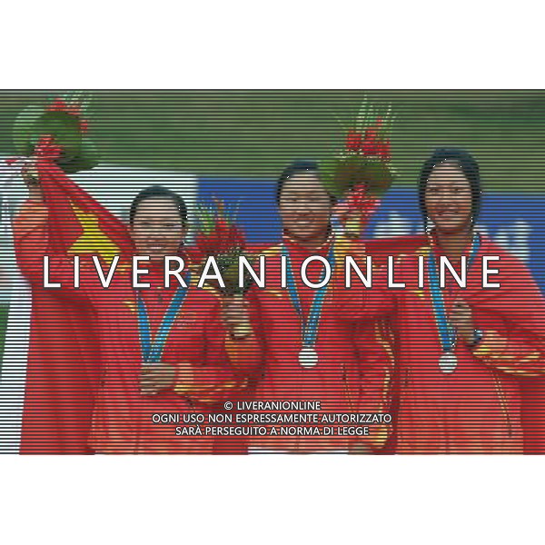 (101120) -- GUANGZHOU, Nov. 20, 2010 () -- Li Jiayun, Yan Jing and Lin Xiyu (from L to R) of China pose during the awarding ceremony of the women\'s team of golf competition at the 16th Asian Games in Guangzhou, south China\'s Guangdong Province, Nov. 20, 2010. China won the silver of the event with 571 scores. (/Yang Shiyao) ©photoshot/Agenzia Aldo Liverani Sas - ITALY ONLY - CINA: 16mi Giochi Asiatici