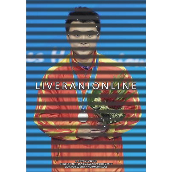 (101120) -- GUANGZHOU, Nov. 20, 2010 () -- Silver medalist Wang Hao of China stands on the podium of the men\'s singles awarding ceremony of table tennis competition at the 16th Asian Games in Guangzhou, south China\'s Guangdong Province, Nov. 20, 2010. (/Xu Jiajun) ©photoshot/Agenzia Aldo Liverani Sas - ITALY ONLY - CINA: 16mi Giochi Asiatici