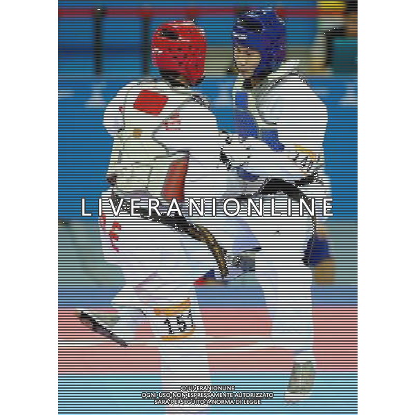 (101120) -- GUANGZHOU, Nov. 20, 2010 () -- Pen-Ek Karaket(R) of Thailand fights against Wei Chen Yang of Chinese Taipei during the final of men\'s under 58kg of taekwondo at the 16th Asian Games in Guangzhou, south China\'s Guangdong Province, Nov. 20, 2010. Wei claimed the title. (/Chen Kai)(wll) ©photoshot/Agenzia Aldo Liverani Sas - ITALY ONLY - CINA: 16mi Giochi Asiatici