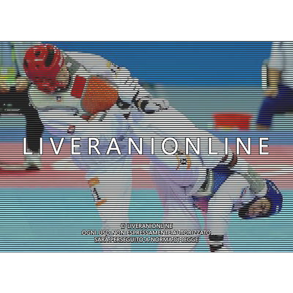 (101120) -- GUANGZHOU, Nov. 20, 2010 () -- Pen-Ek Karaket(R) of Thailand fights against Wei Chen Yang of Chinese Taipei during the final of men\'s under 58kg of taekwondo at the 16th Asian Games in Guangzhou, south China\'s Guangdong Province, Nov. 20, 2010. Wei claimed the title. (/Chen Kai)(wll) ©photoshot/Agenzia Aldo Liverani Sas - ITALY ONLY - CINA: 16mi Giochi Asiatici