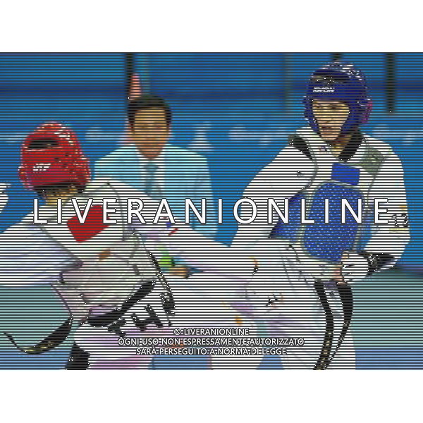 (101120) -- GUANGZHOU, Nov. 20, 2010 () -- Xu Yongzeng(R) of China fights against Pen-Ek Karaket of Thailand during the semifinal of men\'s under 58kg of taekwondo at the 16th Asian Games in Guangzhou, south China\'s Guangdong Province, Nov. 20, 2010. Xu lost the match and took the bronze. (/Chen Kai)(wll) ©photoshot/Agenzia Aldo Liverani Sas - ITALY ONLY - CINA: 16mi Giochi Asiatici