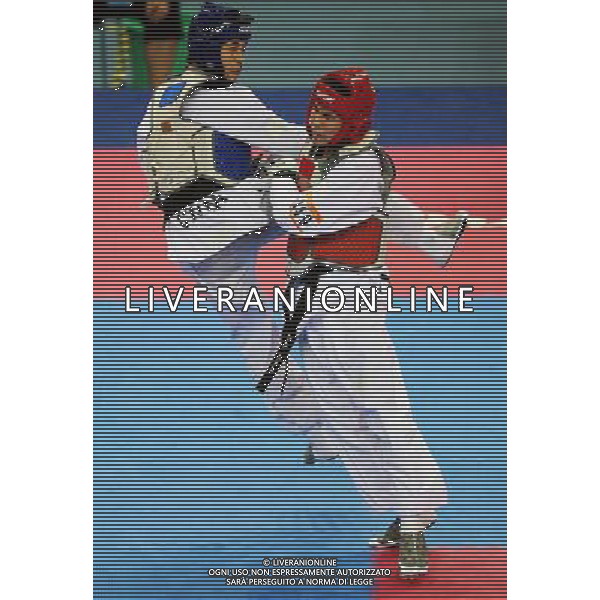 (101120) -- GUANGZHOU, Nov. 20, 2010 () -- Xu Yongzeng(L) of China fights against Pen-Ek Karaket of Thailand during the semifinal of men\'s under 58kg of taekwondo at the 16th Asian Games in Guangzhou, south China\'s Guangdong Province, Nov. 20, 2010. Xu lost the match and took the bronze. (/Guo Dayue)(wll) ©photoshot/Agenzia Aldo Liverani Sas - ITALY ONLY - CINA: 16mi Giochi Asiatici