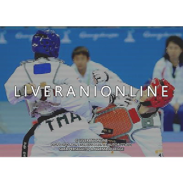 (101120) -- GUANGZHOU, Nov. 20, 2010 () -- Wei Chen Yang (R) of Chinese Taipei fights against Pen-Ek Karaket of Thailand during the final of men\'s under 58kg of taekwondo at the 16th Asian Games in Guangzhou, south China\'s Guangdong Province, Nov. 20, 2010. Wei claimed the title. (/Chen Kai)(wll) ©photoshot/Agenzia Aldo Liverani Sas - ITALY ONLY - CINA: 16mi Giochi Asiatici