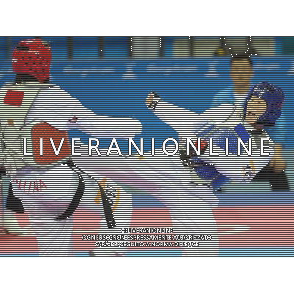 (101120) -- GUANGZHOU, Nov. 20, 2010 () -- Oh Jung Ah(R) of South Korea fights with Liu Rui of China during their final of women\'s over 73kg of taekwondo at the 16th Asian Games in Guangzhou, south China\'s Guangdong Province, Nov. 20, 2010. Liu claimed the title with 4-3. (/Chen Kai)(wll) ©photoshot/Agenzia Aldo Liverani Sas - ITALY ONLY - CINA: 16mi Giochi Asiatici