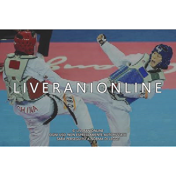 (101120) -- GUANGZHOU, Nov. 20, 2010 () -- Oh Jung Ah(R) of South Korea fights with Liu Rui of China during their final of women\'s over 73kg of taekwondo at the 16th Asian Games in Guangzhou, south China\'s Guangdong Province, Nov. 20, 2010. Liu claimed the title with 4-3. (/Guo Dayue)(wll) ©photoshot/Agenzia Aldo Liverani Sas - ITALY ONLY - CINA: 16mi Giochi Asiatici