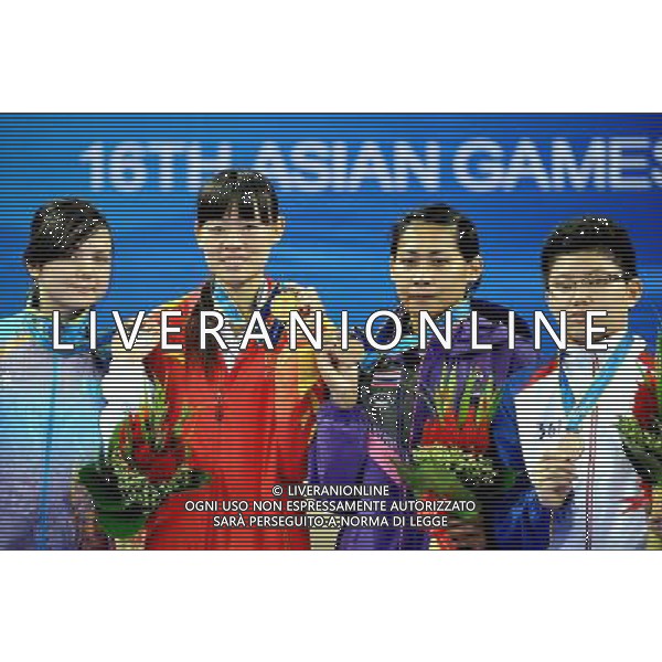 (101120) -- GUANGZHOU, Nov. 20, 2010 () -- Gold medalist Luo Wei(2nd L) of China shows her medal with silver medalist Feruza Yergeshova(L) of Kazakhstan and bronze medalists Rapatkorn Prasopsuk(2nd R) of Thailand and Kirstie Elaine Alora of the Philippines during the awarding ceremony for women\'s under 73kg of taekwondo at the 16th Asian Games in Guangzhou, south China\'s Guangdong Province, Nov. 20, 2010. (/Chen Kai)(wll) ©photoshot/Agenzia Aldo Liverani Sas - ITALY ONLY - CINA: 16mi Giochi Asiatici