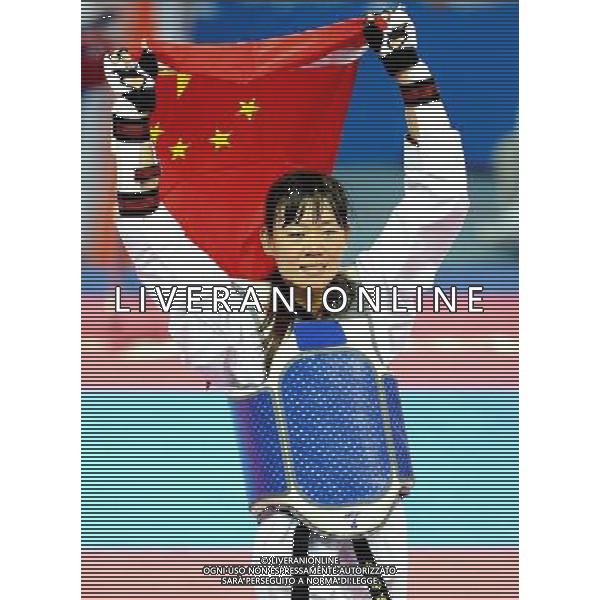 (101120) -- GUANGZHOU, Nov. 20, 2010 () -- Luo Wei of China celebrates her victory after the final of women\'s under 73kg of taekwondo against Feruza Yergeshova of Kazakhstan at the 16th Asian Games in Guangzhou, south China\'s Guangdong Province, Nov. 20, 2010. Luo Wei claimed the title with 5-4. (/Chen Kai)(wll) ©photoshot/Agenzia Aldo Liverani Sas - ITALY ONLY - CINA: 16mi Giochi Asiatici
