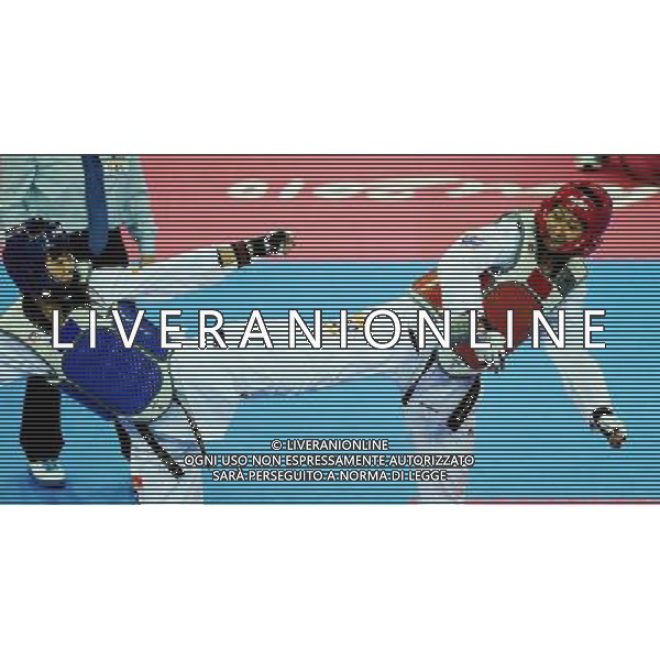 (101120) -- GUANGZHOU, Nov. 20, 2010 () -- Rapatkorn Prasopsuk(R) of Thailand fights with Luo Wei of China during their semifinal of women\'s under 73kg of taekwondo at the 16th Asian Games in Guangzhou, south China\'s Guangdong Province, Nov. 20, 2010. Prasopsuk lost the match and took the bronze. (/Guo Dayue)(wll) ©photoshot/Agenzia Aldo Liverani Sas - ITALY ONLY - CINA: 16mi Giochi Asiatici