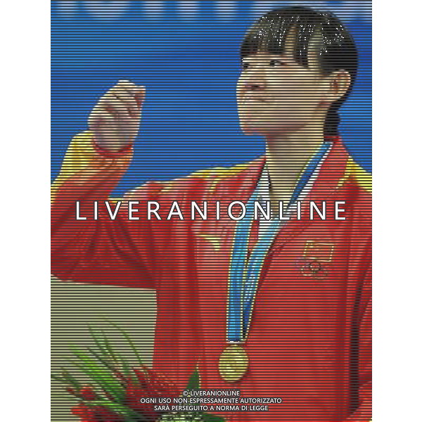 (101120) -- GUANGZHOU, Nov. 20, 2010 () -- Gold medalist Luo Wei of China reacts during the awarding ceremony for women\'s under 73kg of taekwondo at the 16th Asian Games in Guangzhou, south China\'s Guangdong Province, Nov. 20, 2010. (/Chen Kai)(wll) ©photoshot/Agenzia Aldo Liverani Sas - ITALY ONLY - CINA: 16mi Giochi Asiatici