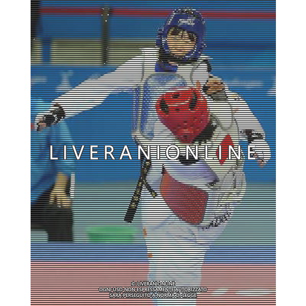 (101120) -- GUANGZHOU, Nov. 20, 2010 () -- Luo Wei(Up) of China fights against Feruza Yergeshova of Kazakhstan during their final of women\'s under 73kg of taekwondo at the 16th Asian Games in Guangzhou, south China\'s Guangdong Province, Nov. 20, 2010. Luo Wei claimed the title with 5-4. (/Chen Kai)(wll) ©photoshot/Agenzia Aldo Liverani Sas - ITALY ONLY - CINA: 16mi Giochi Asiatici