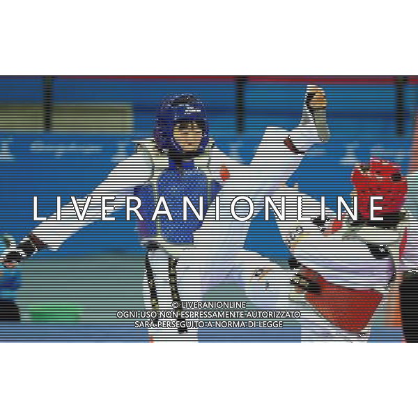 (101120) -- GUANGZHOU, Nov. 20, 2010 () -- Luo Wei(L) of China fights against Feruza Yergeshova of Kazakhstan during their final of women\'s under 73kg of taekwondo at the 16th Asian Games in Guangzhou, south China\'s Guangdong Province, Nov. 20, 2010. Luo Wei claimed the title with 5-4. (/Chen Kai)(wll) ©photoshot/Agenzia Aldo Liverani Sas - ITALY ONLY - CINA: 16mi Giochi Asiatici
