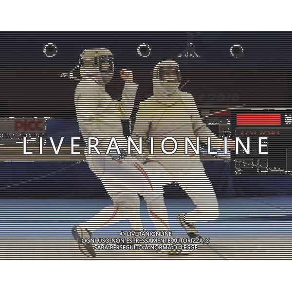 (101122) -- GUANGZHOU, Nov. 22, 2010 () -- China\'s Liu Xiao(R) and Japan\'s Kudo Shinya react during their men\'s team sabre semifinal match of Fencing at the 16th Asian Games in Guangzhou, south China\'s Guangdong Province, Nov. 22, 2010. China won 45-19 to enter the final match. (/Chen Yehua) ©photoshot/Agenzia Aldo Liverani Sas - ITALY ONLY - CINA: 16mi Giochi Asiatici