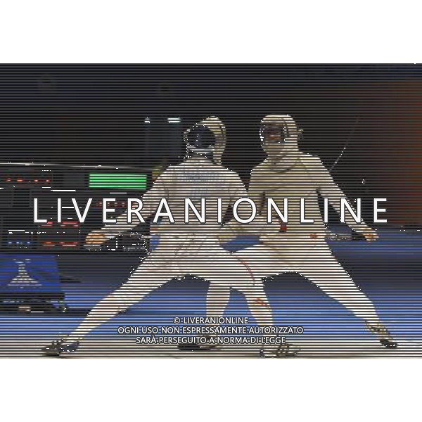 (101122) -- GUANGZHOU, Nov. 22, 2010 () -- China\'s Liu Xiao(R) competes with Japan\'s Yamamoto Koji during their men\'s team sabre semifinal match of Fencing at the 16th Asian Games in Guangzhou, south China\'s Guangdong Province, Nov. 22, 2010. China won 45-19 to enter the final match. (/Chen Yehua) ©photoshot/Agenzia Aldo Liverani Sas - ITALY ONLY - CINA: 16mi Giochi Asiatici