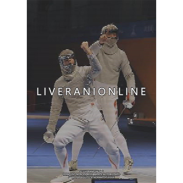 (101122) -- GUANGZHOU, Nov. 22, 2010 () -- China\'s Wang Jingzhi(R) and Japan\'s Kudo Shinya react during their men\'s team sabre semifinal match of Fencing at the 16th Asian Games in Guangzhou, south China\'s Guangdong Province, Nov. 22, 2010. China won 45-19 to enter the final match. (/Chen Yehua) ©photoshot/Agenzia Aldo Liverani Sas - ITALY ONLY - CINA: 16mi Giochi Asiatici