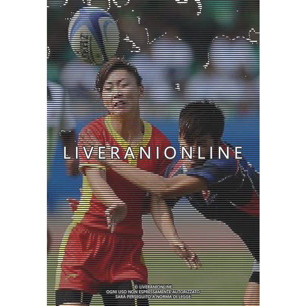 (101121) -- GUANGZHOU, Nov. 21, 2010 () -- Bai Ying (L) of China vies with a player from Hong Kong of China during their Women\'s Preliminary Round Pool A Match of Rugby at the 16th Asian Games in Guangzhou, south China\'s Guangdong Province, Nov. 21, 2010. China won 29-0. (/Chen Kai)(wll) ©photoshot/Agenzia Aldo Liverani Sas - ITALY ONLY - CINA: 16mi Giochi Asiatici