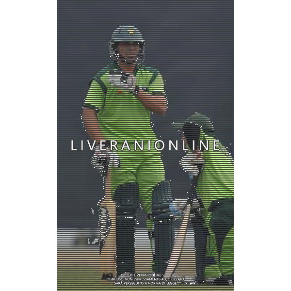 (101122) -- GUANGZHOU, Nov. 22, 2010 () -- Pakistan\'s Khalid Latif (L) talks with Muhammad Azeem Ghumman during the men\'s quarterfinal of cricket against China at the 16th Asian Games in Guangzhou, south China\'s Guangdong Province, Nov. 22, 2010. Pakistan won the match 183-55 and entered the semifinal of the event. (/Liu Dawei) ©photoshot/Agenzia Aldo Liverani Sas - ITALY ONLY - CINA: 16mi Giochi Asiatici
