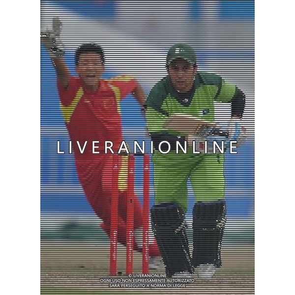 (101122) -- GUANGZHOU, Nov. 22, 2010 () -- Pakistan\'s Muhammad Azeem Ghumman (R) reacts during the men\'s quarterfinal of cricket against China at the 16th Asian Games in Guangzhou, south China\'s Guangdong Province, Nov. 22, 2010. Pakistan won the match 183-55 and entered the semifinal of the event. (/Liu Dawei) ©photoshot/Agenzia Aldo Liverani Sas - ITALY ONLY - CINA: 16mi Giochi Asiatici