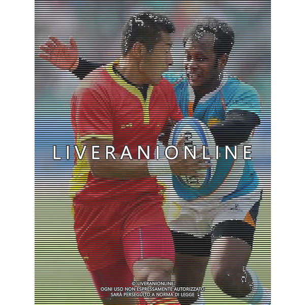(101121) -- GUANGZHOU, Nov. 21, 2010 () -- Jin Ye (L) of China vies with a player of India during their Men\'s Preliminary Round Pool B Match of Rugby at the 16th Asian Games in Guangzhou, south China\'s Guangdong Province, Nov. 21, 2010. China won 61-0. (/Chen Kai)(wll) ©photoshot/Agenzia Aldo Liverani Sas - ITALY ONLY - CINA: 16mi Giochi Asiatici