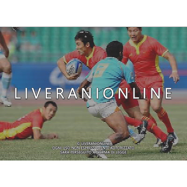 (101121) -- GUANGZHOU, Nov. 21, 2010 () -- Li Yang (R3) of China vies with Thimmaiah Madanda(R2) of India during their Men\'s Preliminary Round Pool B Match of Rugby at the 16th Asian Games in Guangzhou, south China\'s Guangdong Province, Nov. 21, 2010. China won 61-0. (/Chen Kai)(wll) ©photoshot/Agenzia Aldo Liverani Sas - ITALY ONLY - CINA: 16mi Giochi Asiatici