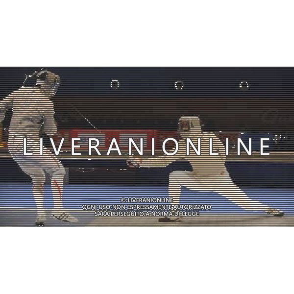 (101122) -- GUANGZHOU, Nov. 22, 2010 () -- China\'s Liu Xiao (R) confronts Japan\'s Kudo Shinya during men\'s team sabre semifinals match of fencing at the 16th Asian Games in Guanghzou, south China\'s Guangdong Province, Nov. 22, 2010. China beat Japan 45-19. (/Chen Yehua) ©photoshot/Agenzia Aldo Liverani Sas - ITALY ONLY - CINA: 16mi Giochi Asiatici