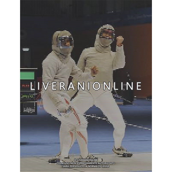 (101122) -- GUANGZHOU, Nov. 22, 2010 () -- China\'s Liu Xiao (R) confronts Japan\'s Kudo Shinya during men\'s team sabre semifinals match of fencing at the 16th Asian Games in Guanghzou, south China\'s Guangdong Province, Nov. 22, 2010. China beat Japan 45-19. (/Chen Yehua) ©photoshot/Agenzia Aldo Liverani Sas - ITALY ONLY - CINA: 16mi Giochi Asiatici