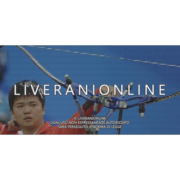 (101122) -- GUANGZHOU, Nov. 22, 2010 () -- China\'s archer Chen Wenyuan competes during men\'s team 1/4 eliminations match of archery at the 16th Asian Games in Guangzhou, south China\'s Guangdong Province, Nov. 22, 2010. China beat Malaysia 224-220. (/Gesang Dawa) ©photoshot/Agenzia Aldo Liverani Sas - ITALY ONLY - CINA: 16mi Giochi Asiatici